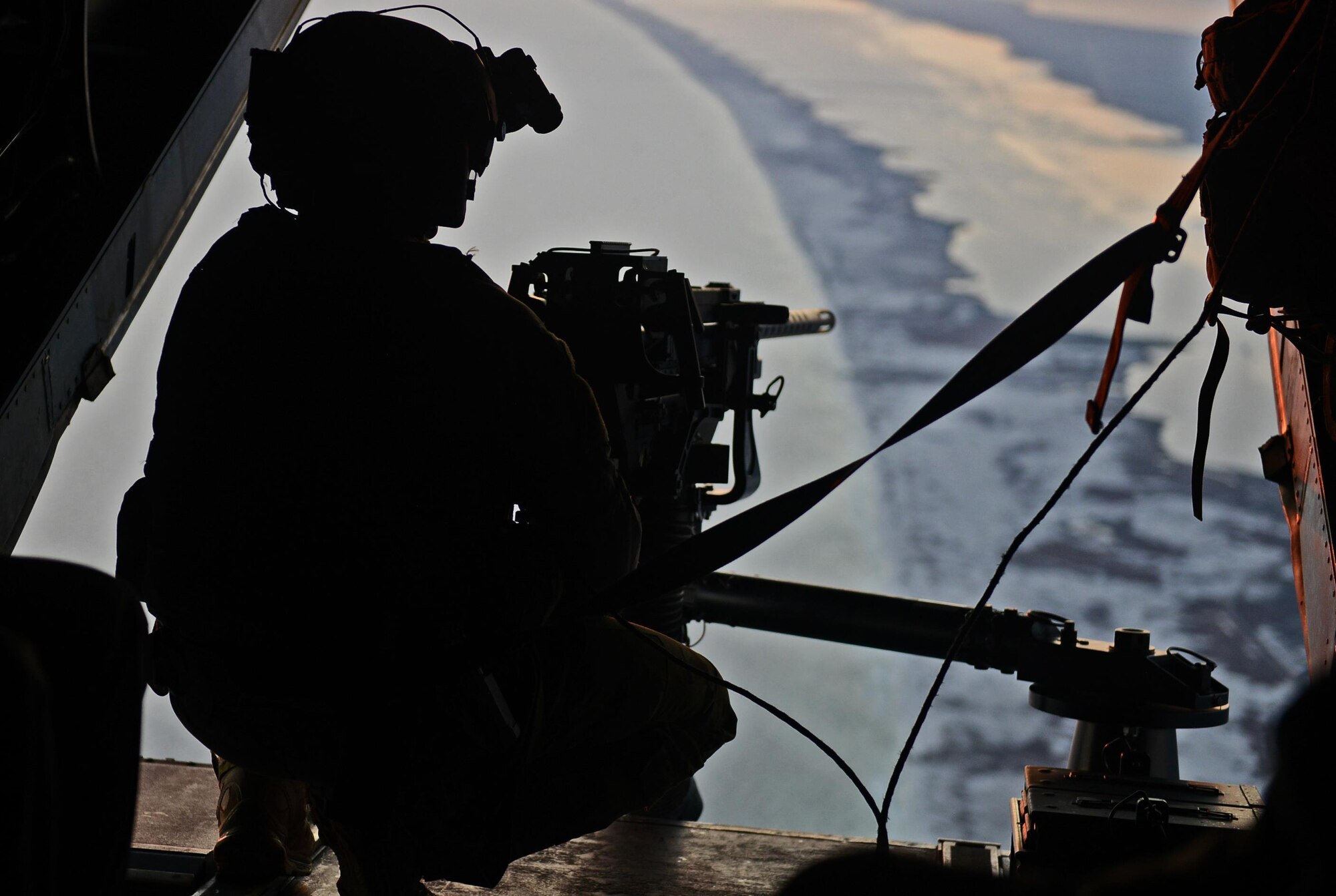 A special mission aviator at the 8th Special Operations Squadron mans the .50 caliber gun on a CV-22 Osprey near Hurlburt Field, Fla., Dec. 12, 2016. Gen. Ellen M. Pawlikowski, commander of Air Force Materiel Command, was onboard to observe the aircraft’s capabilities. (U.S. Air Force photo/Staff Sgt. Melanie Holochwost)