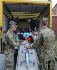 U.S. Army Soldiers assigned to 1st Battalion, 222nd Aviation Regiment, assist U.S. Marines as they load donated toys into trucks at Joint Base Langley-Eustis, Va., Dec. 8, 2016. Some of the toys donated included bicycles, video games and other toys for all age groups. (U.S. Air Force photo by Staff Sgt. Teresa J. Cleveland)