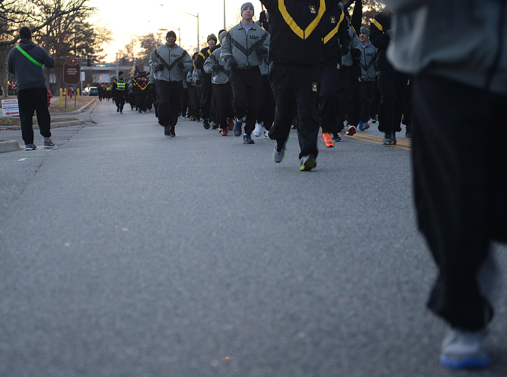 U.S. Army Soldiers run in formation during the annual U.S. Marine Corp’s Toys for Tots holiday run at Joint Base Langley-Eustis, Va., Dec. 9, 2016. Installation leadership supported the runners by running alongside them and cheering them on at the finish line. (U.S. Air Force photo by Staff Sgt. Teresa J. Cleveland)