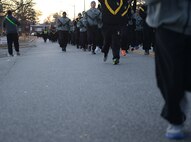 U.S. Army Soldiers run in formation during the annual U.S. Marine Corp’s Toys for Tots holiday run at Joint Base Langley-Eustis, Va., Dec. 9, 2016. Installation leadership supported the runners by running alongside them and cheering them on at the finish line. (U.S. Air Force photo by Staff Sgt. Teresa J. Cleveland)