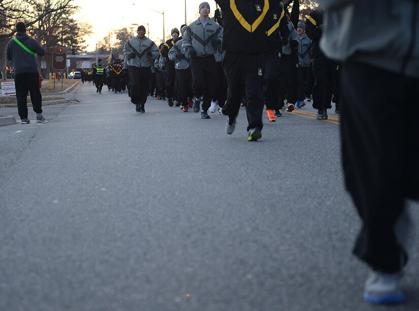 U.S. Army Soldiers run in formation during the annual U.S. Marine Corp’s Toys for Tots holiday run at Joint Base Langley-Eustis, Va., Dec. 9, 2016. Installation leadership supported the runners by running alongside them and cheering them on at the finish line. (U.S. Air Force photo by Staff Sgt. Teresa J. Cleveland)