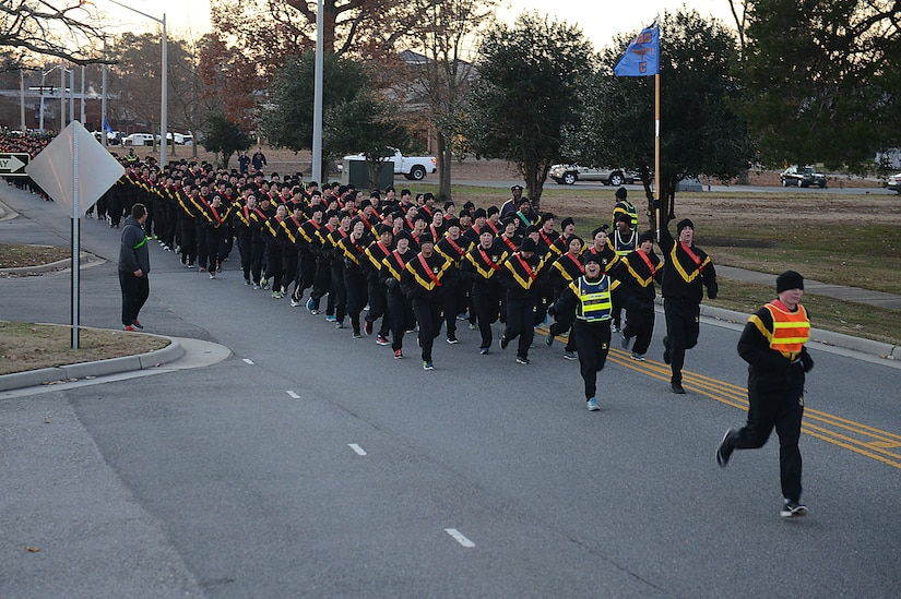 U.S. Army Soldiers run in formation during the annual U.S. Marine Corp’s Toys for Tots holiday run at Joint Base Langley-Eustis, Va., Dec. 9, 2016. The JBLE community donated 5,306 toys to the Toys for Tots program. (U.S. Air Force photo by Staff Sgt. Teresa J. Cleveland)