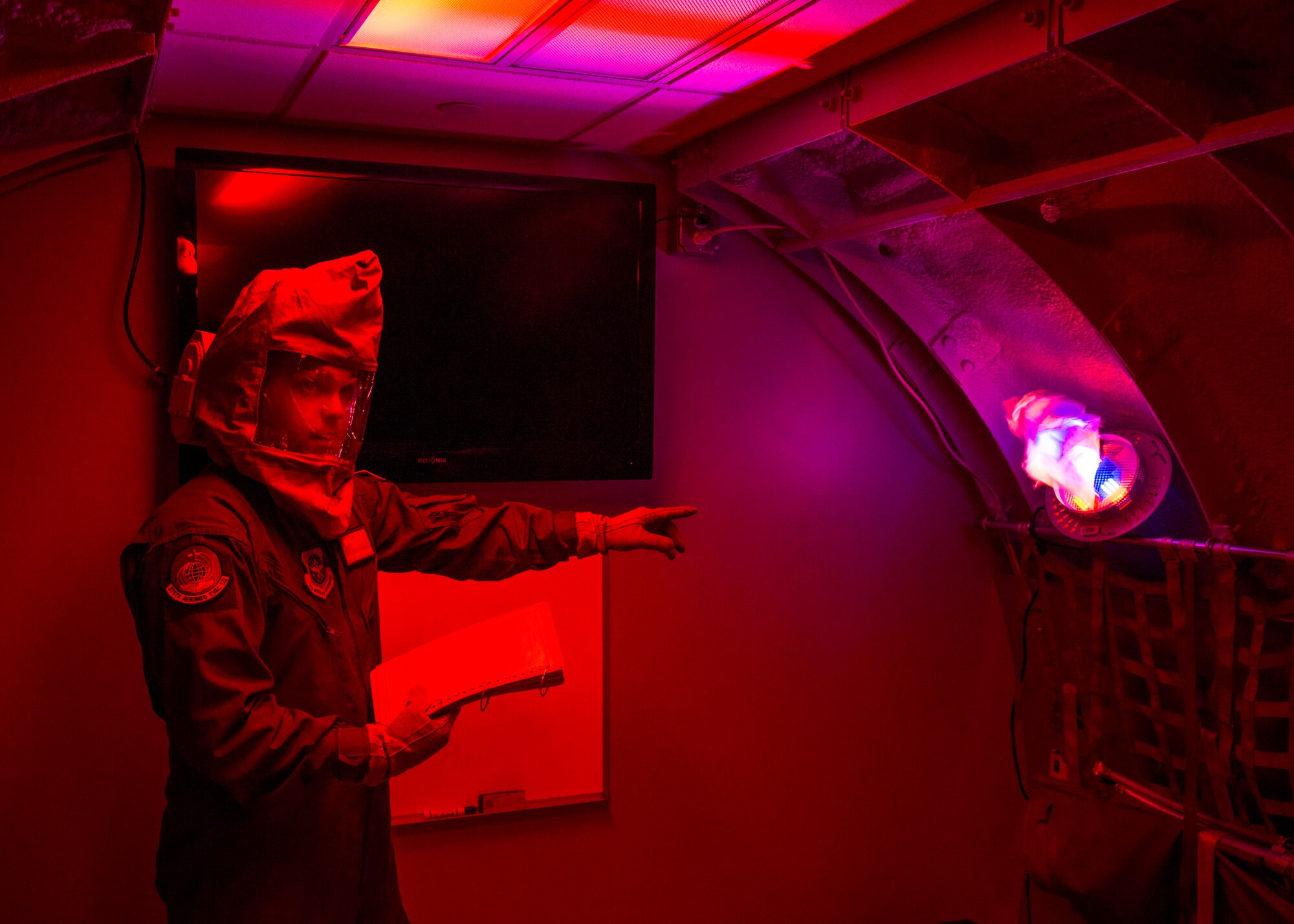 Staff Sgt. Ryan Edwards, 375th AES aeromedical evacuation technician, demonstrates the training capabilities of the Cargo Compartment Trainer at Scott Air Force Base, Ill. on May 5, 2016. Aeromedical evacuation technicians are required to participate in the simulator two times every six months. (U.S. Air Force photo by Airman 1st Class Daniel Garcia)