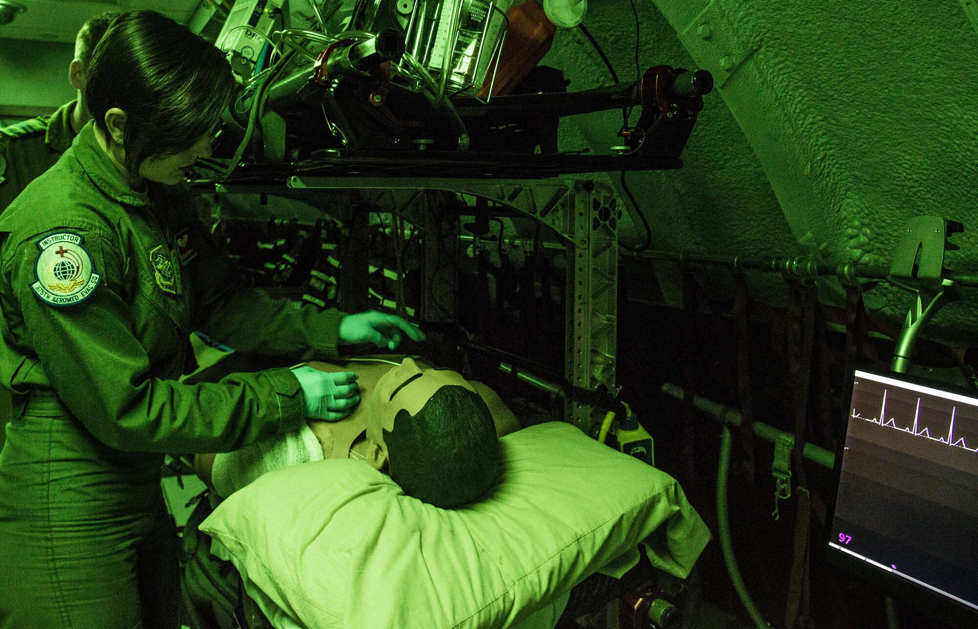 Staff Sgt. Dasha Ermanova conducts medical training aboard the new KC-135 static trainer on Scott Air Force Base, Ill., May 5, 2016. Aeromedical evacuation technicians are required to participate in the simulator two times every six months. (U.S. Air Force photo by Airman 1st Class Daniel Garcia)