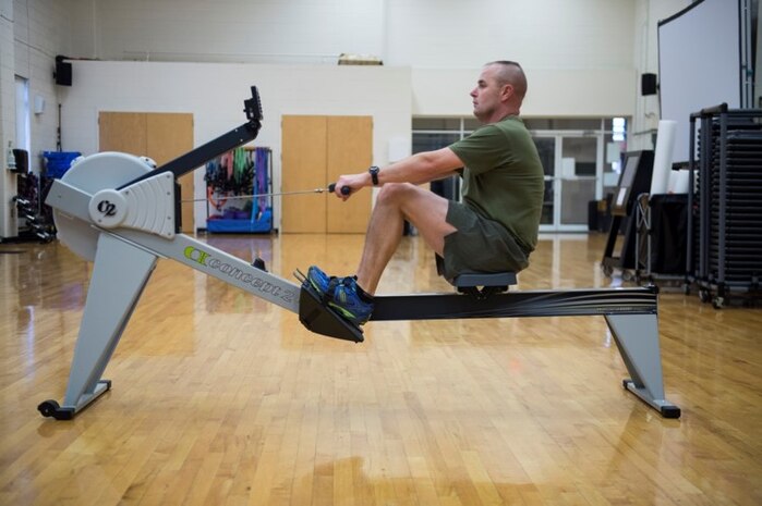 Male Marine demonstrating proper rowing technique