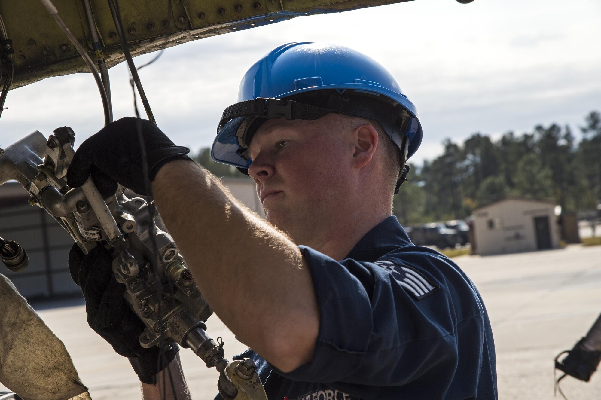 Staff Sgt. Christopher McMinn, 23d Equipment Maintenance Squadron repair and reclamation craftsman, removes extra wiring from an A-10A Thunderbolt II, Dec. 1, 2016, at Moody Air Force Base, Ga. The A-10A is the predecessor to the A-10C model that is currently being used here. (U.S. Air Force photo by Staff Sgt. Eric Summers)