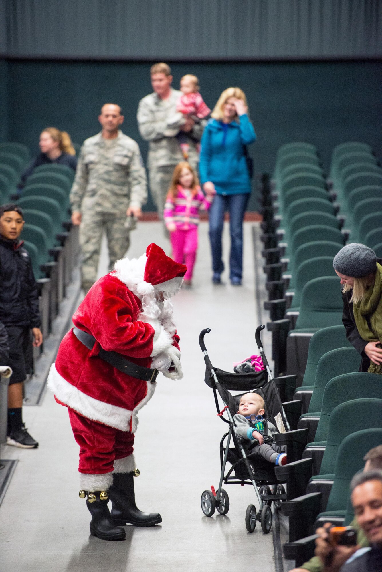 Santa Claus makes an appearance during the annual holiday tree lighting ceremony at Travis Air Force Base, Calif., Dec. 8, 2016. Patrons were treated to music by the U.S. Air Force Band of the Golden West Quartet, a visit from Santa and refreshments. (U.S. Air Force photo/Louis Briscese)