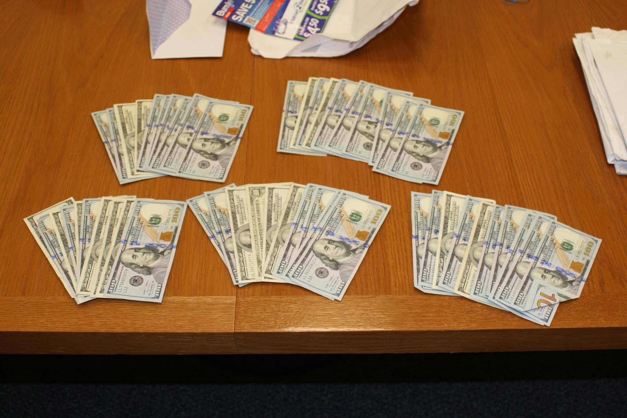 This is the $5,000 seized as evidence following the completion of a bribe made by a sub-contractor to an Air Force Office of Special Investigations informant. The bribe was intended to overlook wiring discrepancies regarding a contract held by a communications company on Joint Base Elmendorf-Richardson, Alaska. (U.S. Air Force photo/OSI Det. 631)    