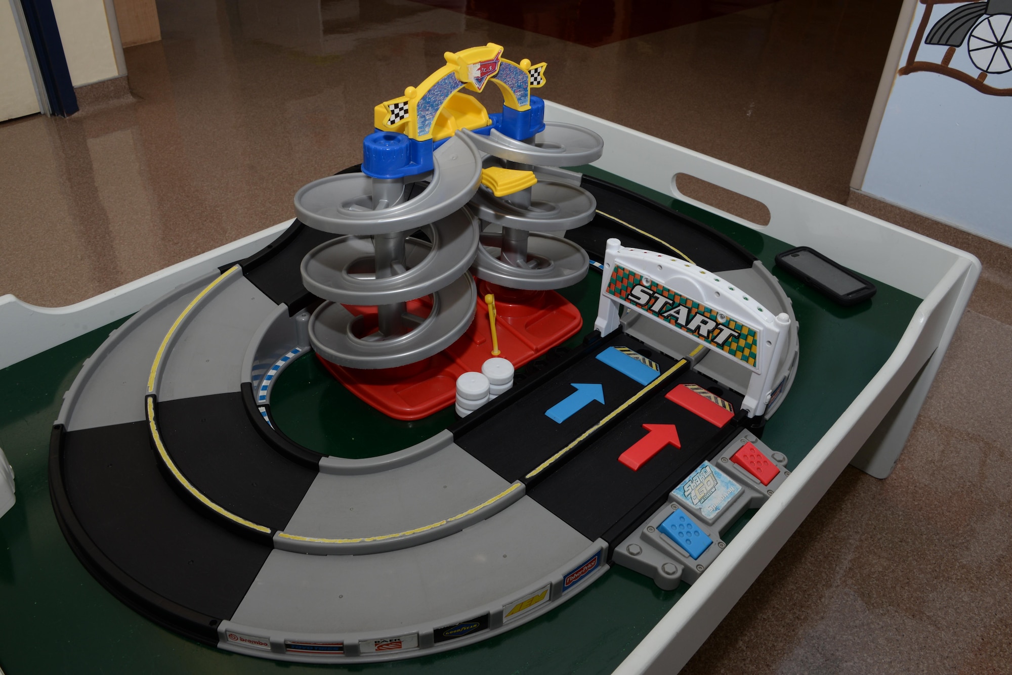 A toy race track is one of many toys children can play with while attending the Teddy’s Child Watch Program at Travis Air Force Base, Calif. The program also offers movies, learning activities and themed play areas. The facility offers military families attending medical appointments at USAF David Grant Medical Center with childcare for free. (U.S. Air Force photo/Tech. Sgt. James Hodgman)