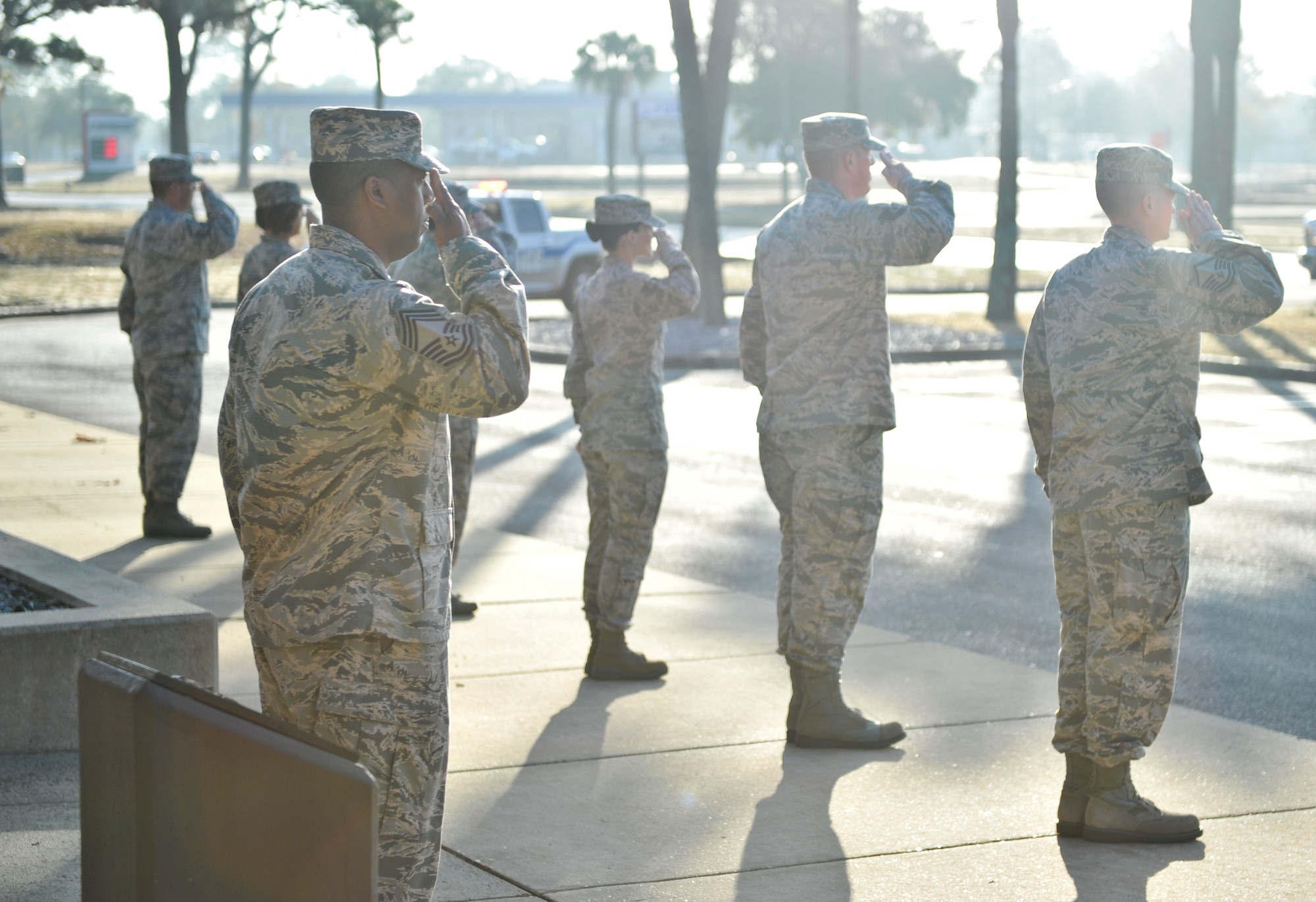 Chief Master Sgt. Darnell Burton, NCO Academy commandant, and academy instructors render a salute to incoming honorees of the Legacy of Valor event at Tyndall Air Force Base, Fla., Dec. 13, 2016. As classes attended the academy, the each picked through hundreds of enlisted Airmen and identified 14 of the most extraordinary to represent each flight. (U.S. Air Force photo by Senior Airman Dustin Mullen/Released) 