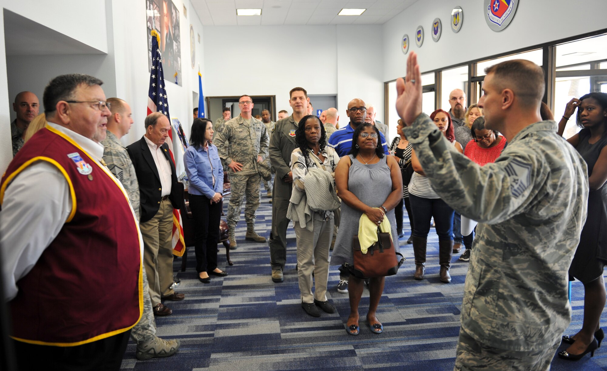 U.S. Air Force Senior Master Sgt. Robert Compton, Paul W. Airey NCO Academy director of education, prepares to lead a tour of the academy at Tyndall Air Force Base, Fla., Dec. 13, 2016. Each classroom throughout the academy is named after  enlisted Airmen  who were hand-picked by NCO Academy classes for their unwavering heroism and courage. (U.S. Air Force photo by Senior Airman Dustin Mullen/Released)