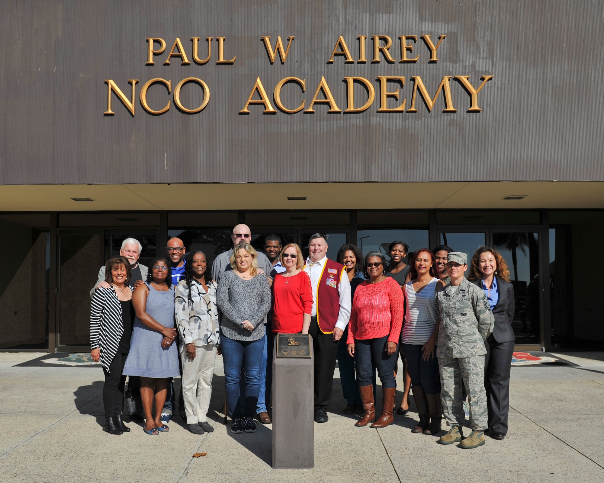 Honorees of the Paul W. Airey NCO Academy’s Legacy of Valor event gather in front of the academy at Tyndall Air Force Base, Fla., Dec. 13, 2016. During the event, honorees toured the NCO Academy and were given a chance to see the rooms named after them or their loved ones. (U.S. Air Force photo by Senior Airman Dustin Mullen/Released)