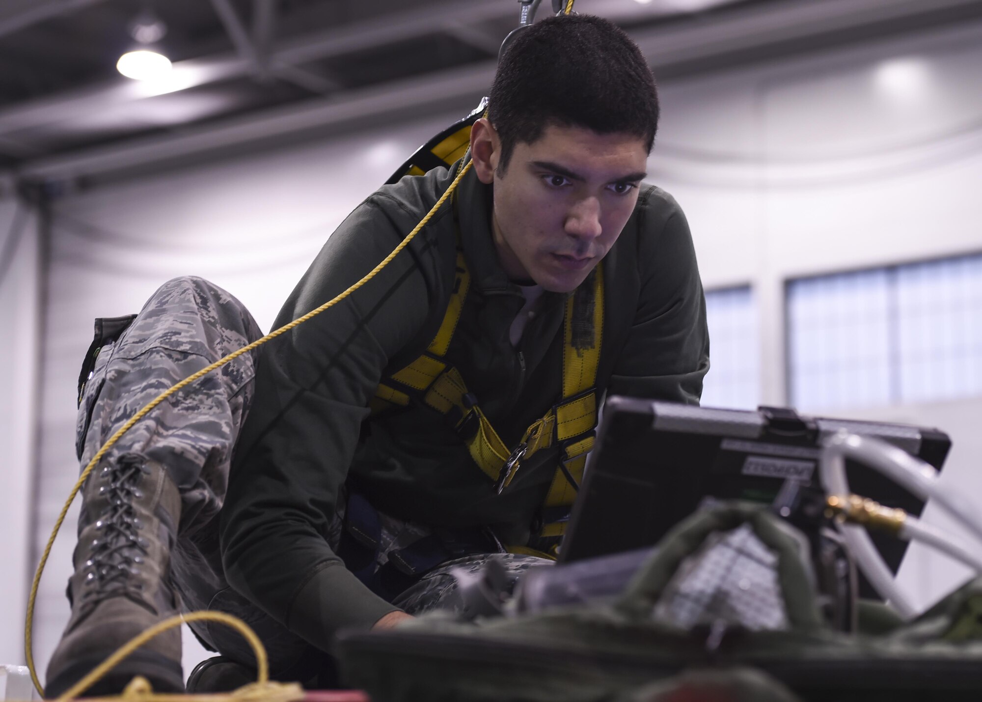 U.S. Air Force Senior Airman Leonard Miller, 19th Maintenance Squadron fuel systems repair craftsman, performs a diagnostics check on a C-130J fuel cell system Dec. 5, 2016, in Hangar 232 on Little Rock Air Force Base, Ark. An average of three-to-four aircraft are inspected and repaired weekly by fuels Airmen. (U.S. Air Force photo/Senior Airman Harry Brexel)