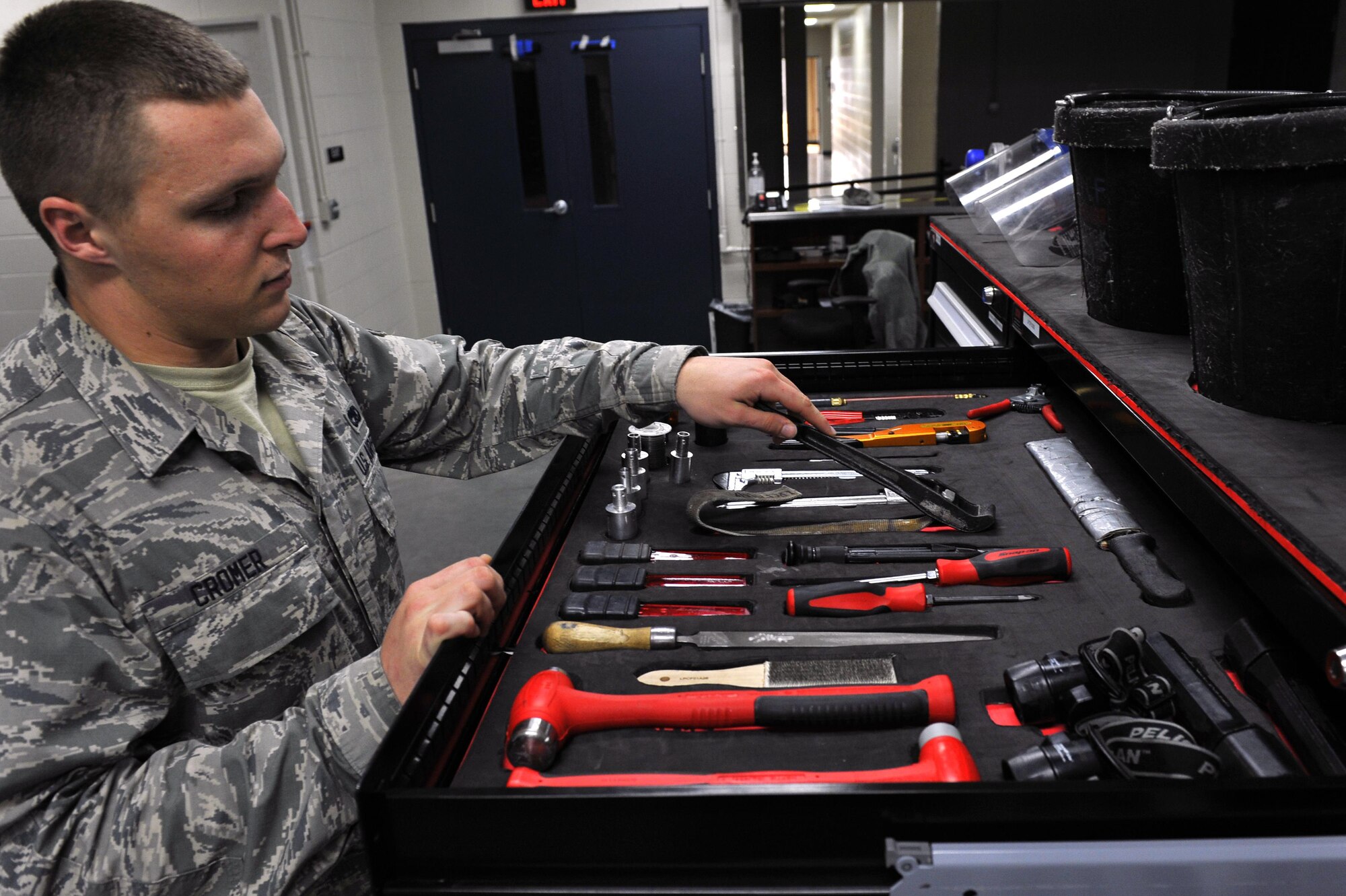 U.S. Air Force Senior Airman Andrew Cromer, 19th Maintenance Squadron aircraft fuel systems repair journeyman, inspects a tool kit Dec. 13, 2016, in Hangar 232 on Little Rock Air Force Base, Ark. The fuel systems shop allows maintainers to check out additional tools necessary to keep the Team Little Rock fleet airborne. (U.S. Air Force photo/Airman 1st Class Kevin Sommer Giron)