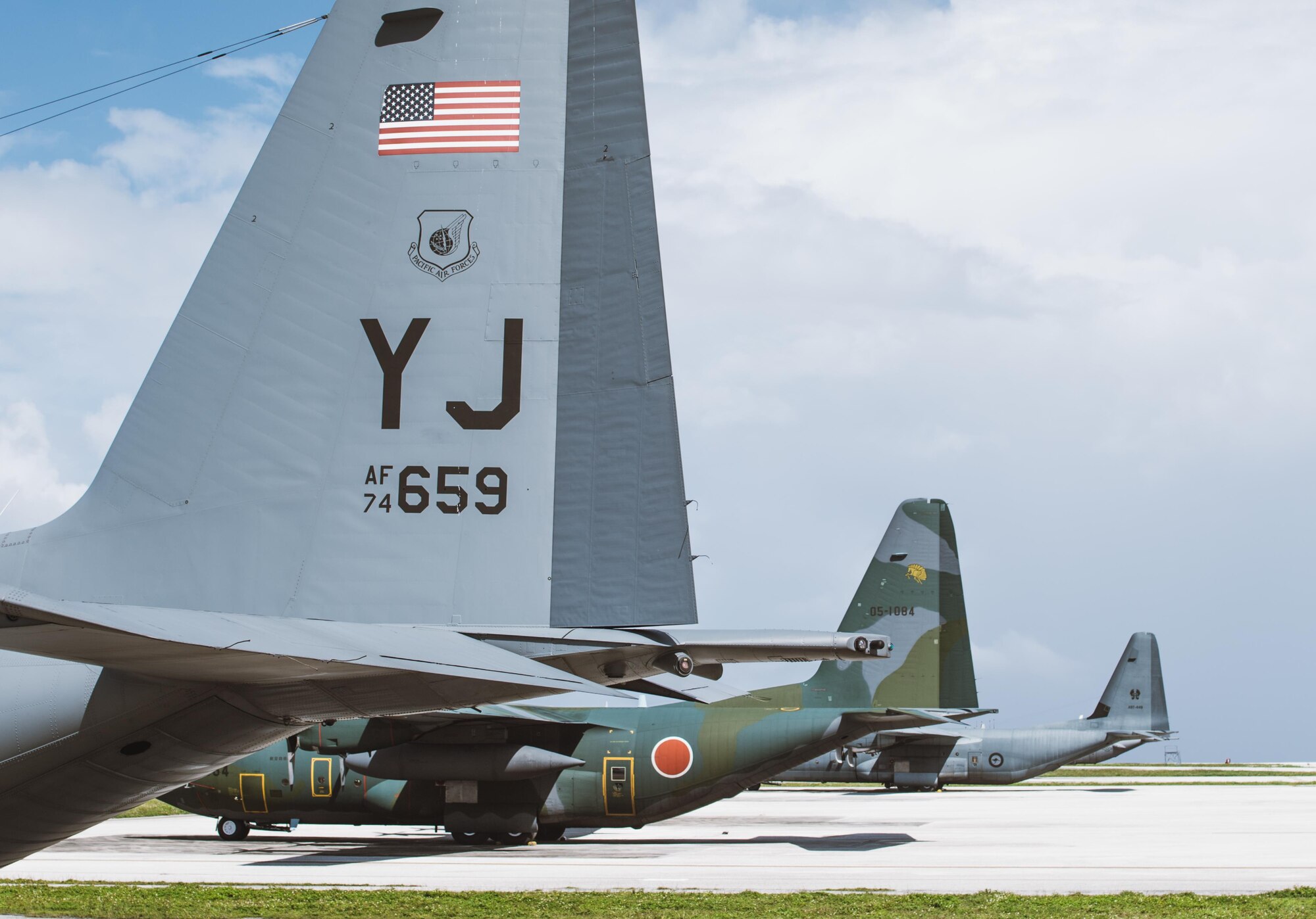 C-130s from the U.S. Air Force, Japan Air Self-Defense Force and Royal Australian Air Force park on the ramp during Operation Christmas Drop 2016 at Andersen Air Force Base, Guam, Dec. 4, 2016. Operation Christmas Drop highlights the U.S. and allied airpower capabilities to orient and respond to activities in peacetime and crisis. (U.S. Air Force photo by Senior Airman Delano Scott/Released)