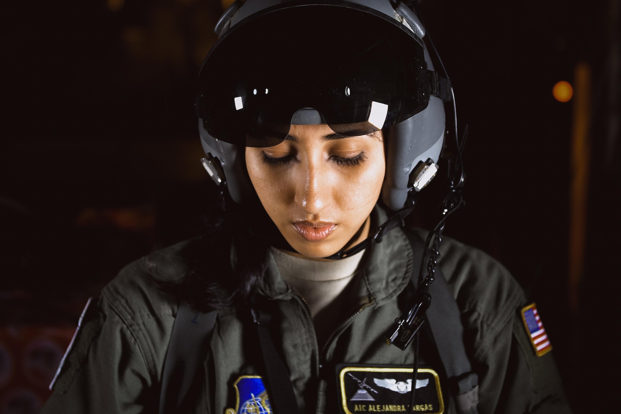 Airman 1st Class Alejandra Vargas, 36th Airlift Squadron C-130 Hercules loadmaster, preps her flight equipment over remote Micronesian islands during Operation Christmas Drop 2016, Dec. 6, 2016. Operation Christmas Drop highlights the U.S. and allied airpower capabilities to orient and respond to activities in peacetime and crisis. In addition to delivering critical supplies to those in need, Operation Christmas Drop provides specific training to U.S. and allied aircrews, enabling theater-wide airpower. (U.S. Air Force photo by Senior Airman Delano Scott/Released)