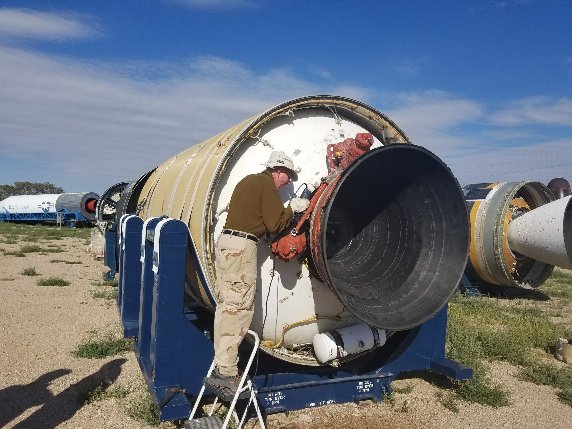 Volunteers from the Space and Missile Systems Center Launch Enterprise Directorate’s Experimental Launch and Test Division based at Kirtland Air Force Base, New Mexico restore a Peacekeeper Intercontinental Ballistic Missile for a new exhibit at the National Museum of Nuclear Science and History’s Heritage Park. 