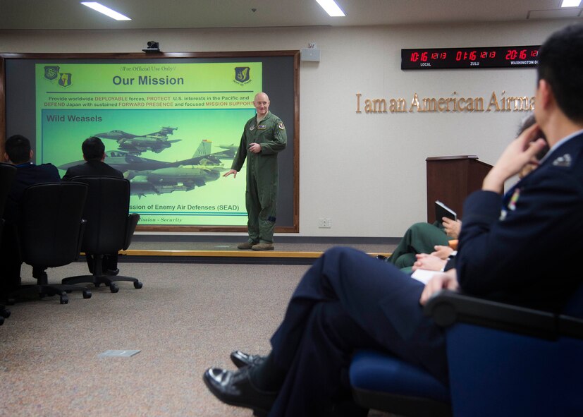 U.S. Air Force Col. Travis Rex, the 35th Fighter Wing vice commander, briefs Japanese and Republic of Korea colonels and lieutenant colonels about the 35th FW mission and the F-16 Fighting Falcon’s capabilities at Misawa Air Base, Japan, Dec. 13, 2016. These 49 leaders are a part of the Senior Officers Leadership Course and included Japanese navy, army and air force leaders. (U.S. Air Force photo by Senior Airman Deana Heitzman)