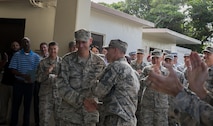 U.S. Air Force Senior Master Sgt. Michael Knox, 18th Civil Engineer Squadron operations flight chief, is congratulated by Chief Master Sgt. Dustin Green, 18th Civil Engineer Group superintendent, Dec. 8, 2016, at Kadena Air Base, Japan. Eight of Kadena’s senior master sergeants were selected for promotion to the rank of chief master sergeant. (U.S. Air Force photo by Senior Airman Lynette M. Rolen/Released)