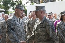 U.S. Air Force Senior Master Sgt. John Payne, 18th Civil Engineer Group first sergeant, is congratulated by Chief Master Sgt. Michael Ditore, 18th Wing command chief, Dec. 8, 2016, at Kadena Air Base, Japan. Leaders selected to the rank of chief master sergeant represent one percent of the enlisted force. (U.S. Air Force photo by Senior Airman Lynette M. Rolen/Released)