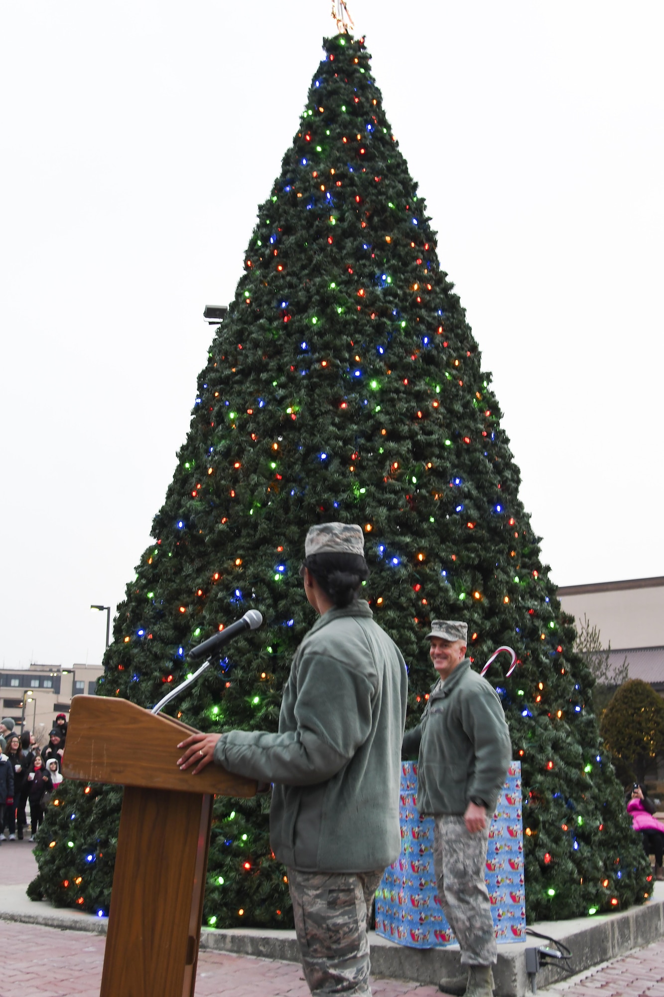 Col. Andrew Hansen, 51st Fighter Wing commander, smiles as he pulls the switch to light up the Christmas tree during the lighting ceremony at Osan Air Base, Republic of Korea, Dec. 8, 2016. The tree lighting ceremony began with the Osan Chapel Children’s Choir singing Christmas carols, the lighting of the Christmas tree, and ending the evening with a visit from Santa Claus. (U.S. Air Force photo by Tech. Sgt. Rasheen Douglas)