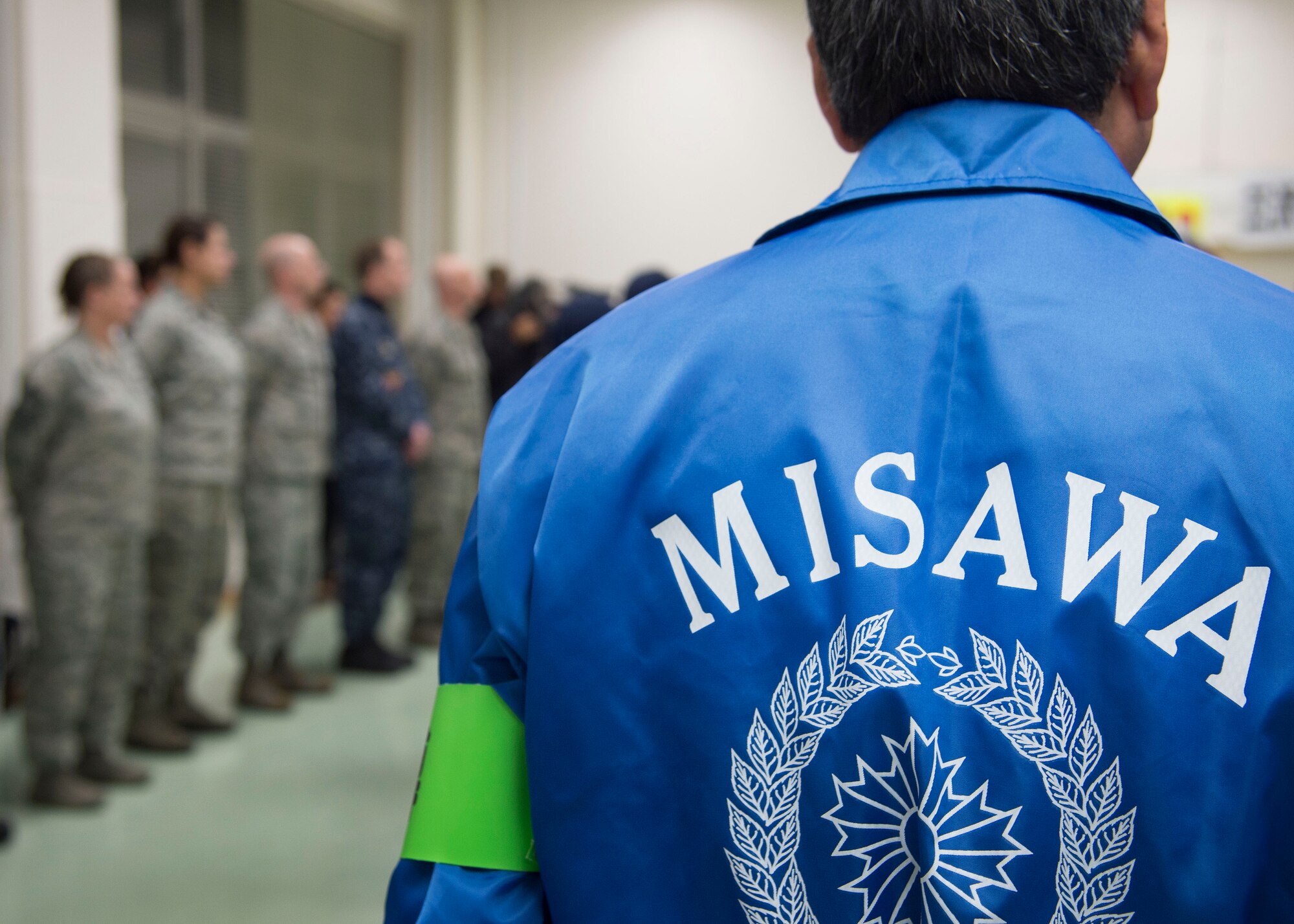 The word “Misawa” is displayed on a jacket during the opening ceremony of the End-Of-Year Traffic Safety and Crime Prevention Campaign in Misawa City, Japan, Dec. 14, 2016. The ceremony gathered base leadership, the Misawa City mayor, police officers and other community prevention program volunteers to stress the importance of working together to make the Misawa community a better place. (U.S. Air Force photo by Senior Airman Deana Heitzman)