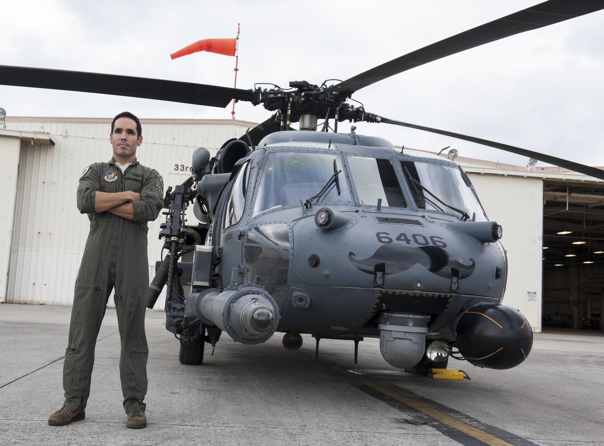 U.S. Air Force Maj. Anibal Aguirre, 33rd Rescue Squadron weapons and tactics officer, piloted one of the HH-60G Pave Hawks during the rescue of five MV-22 Osprey crewmembers Dec. 13, 2016. Members of the 33rd RQS participated in the successful rescue of the Marines alongside members of the 31st RQS, Japan Air Self-Defense Force and the Japan Coast Guard following a shallow water landing off the coast of Okinawa near Camp Schwab. (U.S. Air Force photo by Senior Airman Lynette M. Rolen/Released)