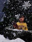 Lucas Ybay, son of Master Sgt. Robert Ybay, 1st Combat Communications Squadron flight chief, watches snow fall around him during Elf Bootcamp at Ramstein Air Base, Germany, Dec. 1, 2016. Elf Bootcamp is a Christmas celebration held at the Ramstein Community Center for children to get into the Christmas spirit with arts and crafts, karaoke, and other games. This was the second annual Elf Bootcamp here. (U.S. Air Force photo by Airman 1st Class Savannah L. Waters)