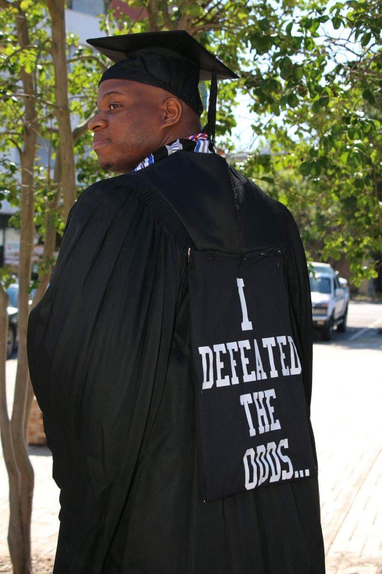 Tyrone Johnson, currently a 386th Expeditionary Force Support Squadron services journeyman, poses for a picture for his college graduation at Mississippi State University in Meridian, Miss. on May 6, 2016. Johnson is the first member of his family to graduate from college. (Courtesy photo/Tyrone Johnson)