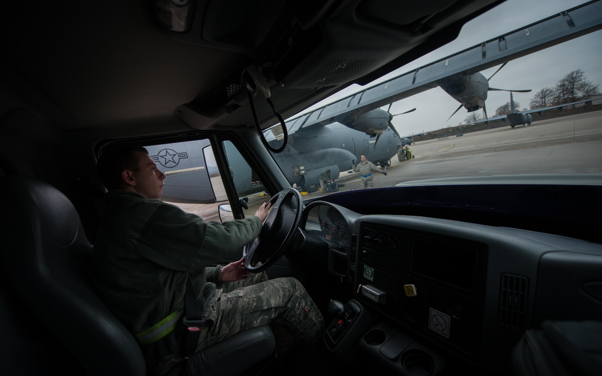 Airman 1st Class Austin Bashaw, 86th Logistics Readiness Squadron fuels specialist, parks a fuel truck beside a C-130J Super Hercules at Ramstein Air Base, Germany, Dec. 12, 2016. Fuels specialists work with maintenance Airmen as well as pilots throughout the process of transporting fuel to aircraft across the flightline. (U.S. Air Force photo by Airman 1st Class Lane T. Plummer)