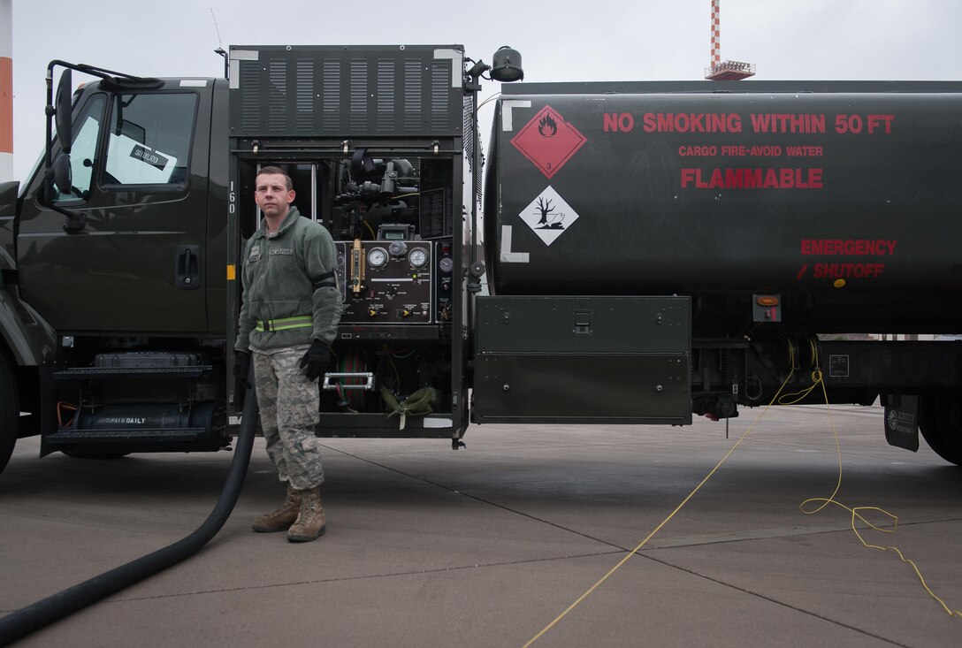 Airman 1st Class Austin Bashaw, 86th Logistics Readiness Squadron fuels specialist, observes as fuel is pumped into a C-130J Super Hercules at Ramstein Air Base, Germany, Dec. 12, 2016. It is the job of fuels specialists to manage every aspect of refueling for every aircraft on the flightline. More than handling fuel, these professionals are also responsible for operating the vehicles, equipment and storage facilities that are essential to the refueling operation while also ensuring the compliance of all safety regulations while handling these volatile liquids. (U.S. Air Force photo by Airman 1st Class Lane T. Plummer)