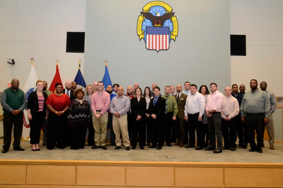 DLA Pathways to Career Excellence Program graduate Dec. 13 during a ceremony at DLA Troop Support in Philadelphia. The 56 graduates completed the two-year training program through on-the-job assignments, cross-training, rotational assignments and formal training.
