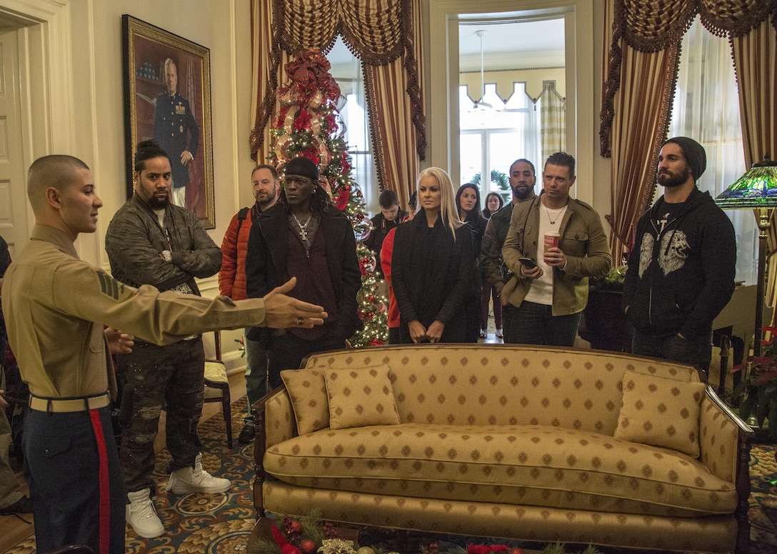 Sgt. Angel Rodriguez, a docent with Marine Barracks Washington, gives the World Wrestling Entertainment Superstars a tour of the Commandant’s home during the WWE Tribute to the Troops visit, Marine Barracks Washington, D.C., Dec. 13, 2016. Each year, the USO-Metro D.C. hosts the Tribute to the Troops for military installations across the Washington-Baltimore region in honor of our service members and their families. (Official Marine Corps photo by Lance Cpl. Robert Knapp/Released)