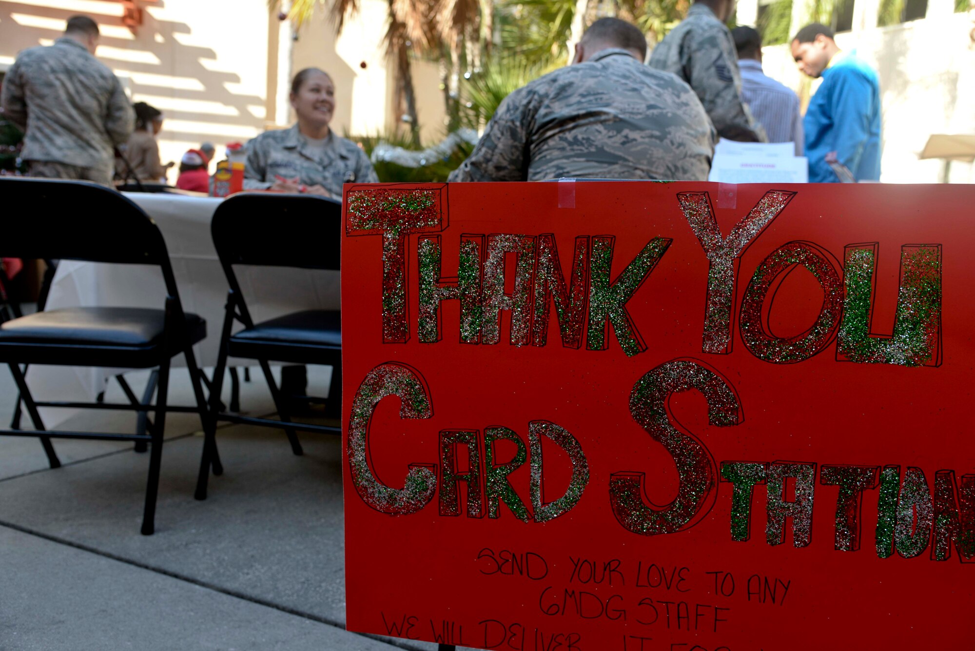 Personnel assigned to the 6th Medical Group (MDG) write “thank you” cards during the 6th MDG appreciation event at MacDill Air Force Base, Fla., Dec. 14, 2016. Cards written by medical staff members and patients were hand-delivered to various personnel in the 6th MDG. (U.S. Air Force photo by Senior Airman Vernon L. Fowler Jr.)