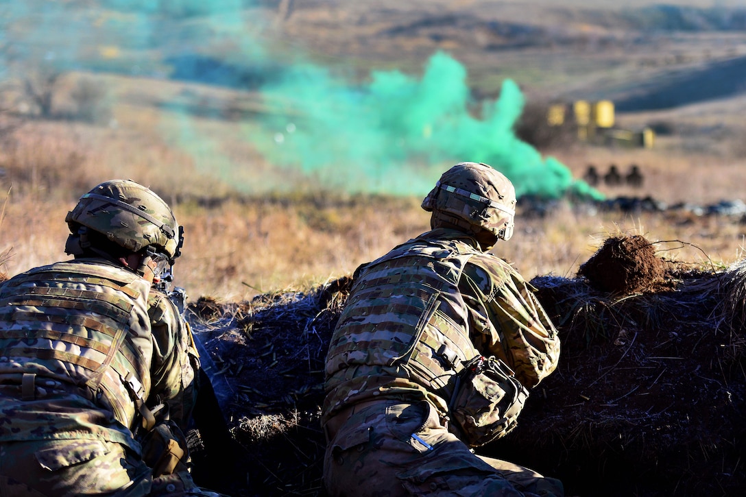 Soldiers engage targets under the cover of smoke during a live-fire exercise as part of Exercise Mountain Shock at Pocek Range in Slovenia, Dec. 9, 2016. Army photo by Davide Dalla Massara