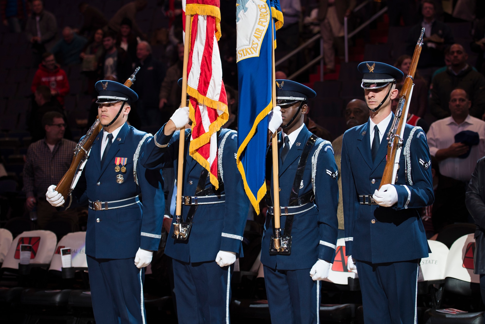 Members of the U.S. Air Force Honor Guard post the colors during the Washington Wizards’ Air Force night at the Verizon Center in Washington, D.C., Dec. 14, 2016. The night also consisted of the U.S. Air Force Honor Guard Drill team performance during halftime. The Wizards beat the Charlotte Hornets 109 – 106. (U.S. Air Force photo by Senior Airman Ryan J. Sonnier)