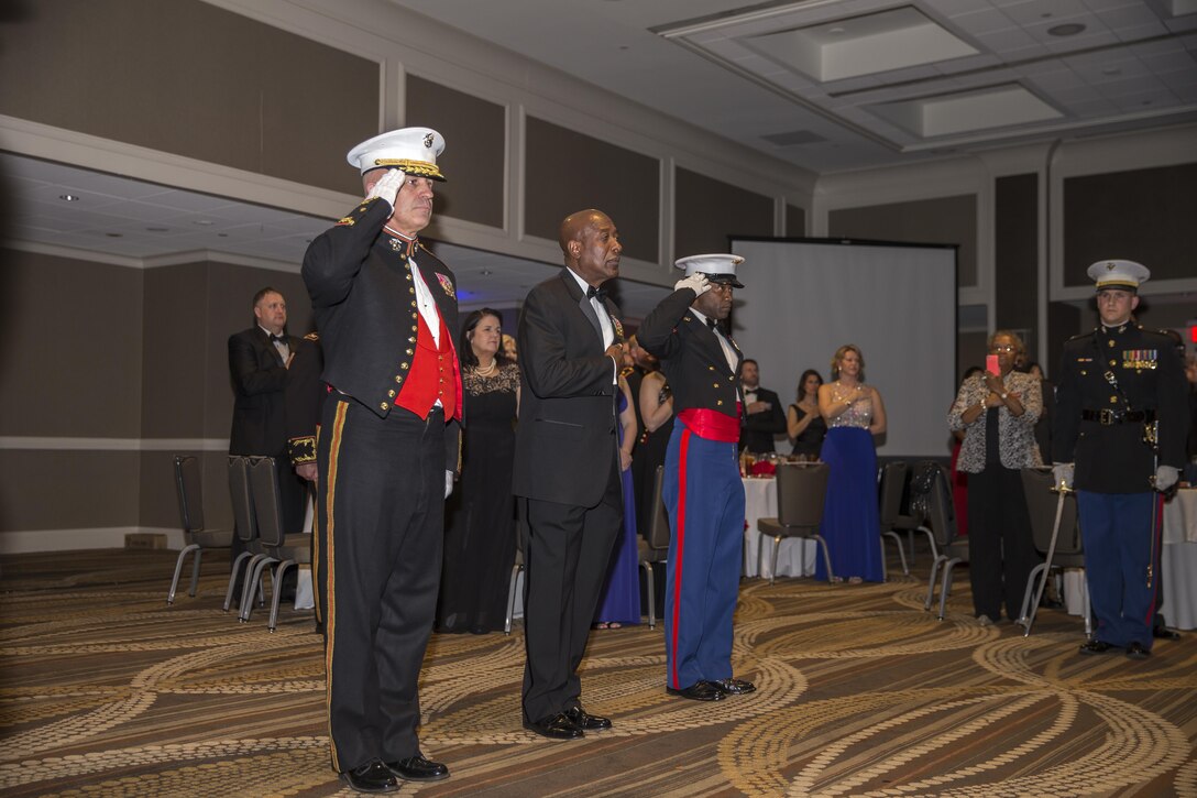 Marine Corps Recruiting Command (MCRC) Commanding General and Sergeant Major, U.S. Marine Corps Maj. Gen. Paul Kennedy, left, Sgt. Maj. Samuel Heyward Jr., right, and guest of honor, Sgt. Maj. Carlton M. Kent, ret., 16th Sergeant Major of the Marine Corps, render honors while the National Anthem is played during the MCRC 241st Marine Corps birthday ball at the Renaissance Hotel, Washington, D.C., Nov. 5, 2016. The ceremony is held annually to celebrate the tradition and history of the Marine Corps. (U.S. Marine Corps photo by Lance Cpl. Alexander Cockrell)