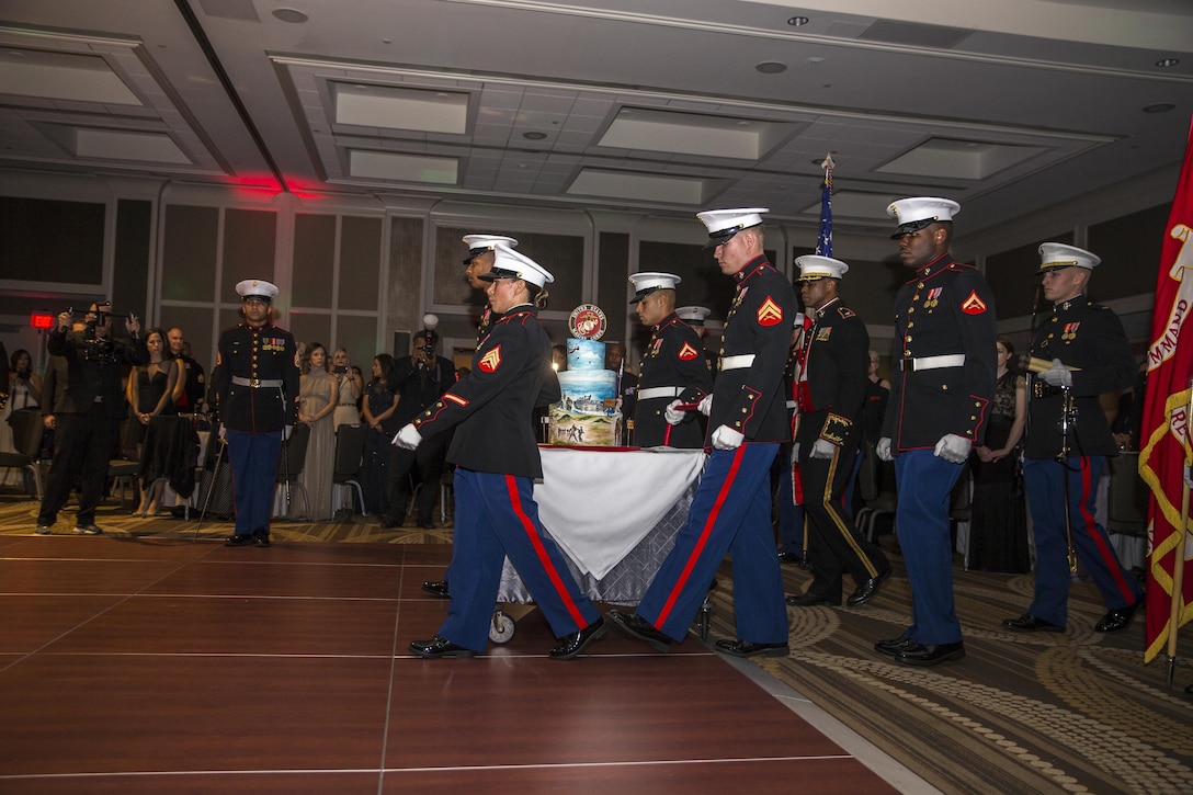 U.S. Marine Corps Recruiting Command (MCRC) cake detail walk in the birthday cake for the cake cutting ceremony during the MCRC 241st Marine Corps birthday ball at the Renaissance Hotel, Washington, D.C., Nov. 5, 2016. The ceremony is held annually to celebrate the tradition and history of the Marine Corps. (U.S. Marine Corps photo by Lance Cpl. Alexander Cockrell)