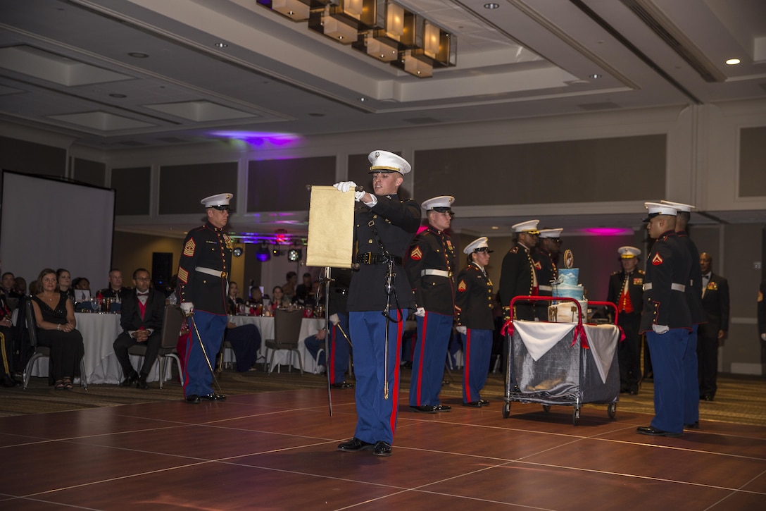 A U.S. Marine reads the Gen. John A. Lejeune, 13th commandant of the Marine Corps, birthday message to the attendees during the 241st Marine Corps birthday ball for Marine Corps Recruiting Command at the Renaissance Hotel, Washington, D.C., Nov. 5, 2016. The ceremony is held annually to celebrate the tradition and history of the Marine Corps. (U.S. Marine Corps photo by Lance Cpl. Alexander Cockrell)