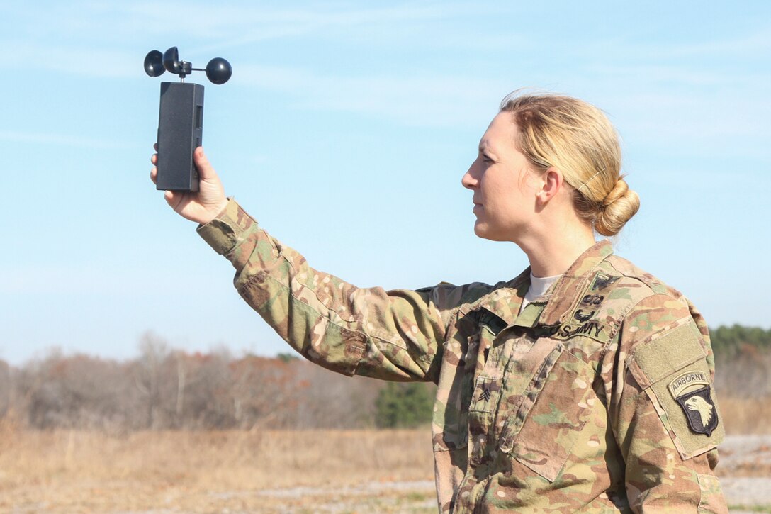 Sgt. Kathryn Kidwell, a motor transport operator with 74th Transportation Company, 129th Combat Sustainment Support Battalion, 101st Airborne Division (Air Assault) Sustainment Brigade, 101st Abn. Div., holds a wind drift indicator to check the wind speed on Suckchon Drop Zone, Dec. 7, 2016, on Fort Campbell, Ky. Kidwell and Soldiers from her company partnered with parachute riggers from 861st Quartermaster Company, a reserve unit from Nashville, Tn., to perform aerial delivery and recovery training. (U.S. Army photo by Sgt. Neysa Canfield/101st Airborne Division Sustainment Brigade Public Affairs)