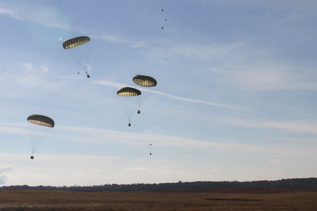 Parachute bundles drift in the sky before landing on Suckchon Drop Zone, Dec. 7, 2016, during airdrop training on Fort Campbell, Ky. Soldiers from 74th Transportation Company, 129th Combat Sustainment Support Battalion, 101st Airborne Division (Air Assault) Sustainment Brigade, 101st Abn. Div., and 861st Quartermaster Company, a reserve unit from Nashville, Tn., unit to conduct aerial delivery and recovery training. (U.S. Army photo by Sgt. Neysa Canfield/101st Airborne Division Sustainment Brigade Public Affairs)