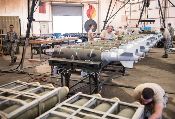 Airmen from the Vermont Air National Guard assemble 500-pound joint direct attack munitions at the 407th Air Expeditionary Group, Southwest Asia, Dec. 2, 2016. The munitions will be used by 134th Expeditionary Fighter Squadron while working with a coalition of about 60 regional and international nations to counter ISIL’s campaign in Iraq and Syria. (U.S. Air Force photo/Master Sgt. Benjamin Wilson)