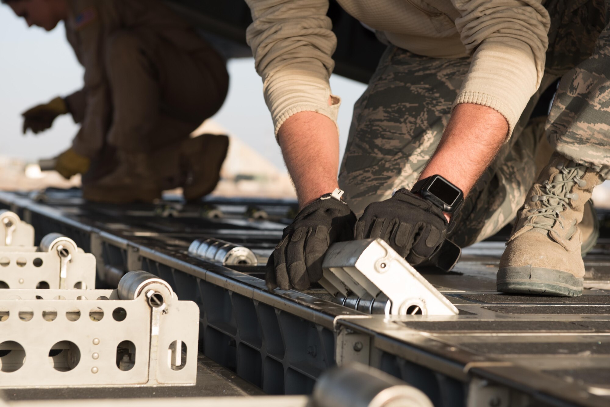 Airmen from the 407th Expeditionary Logistics Readiness Squadron and the 8th Airlift Squadron unload cargo from a C-17 Globemaster III from Joint Base Lewis-McChord, Wash., delivering supplies to the 407th Air Expeditionary Group Dec. 6, 2016, in preparation for the arrival of an F-16 squadron. An advanced team prepared the installation for the arrival of the fighter jets, enabling the squadron to begin combat missions within 24 hours of arrival. (U.S. Air Force photo/Master Sgt. Benjamin Wilson)(Released)