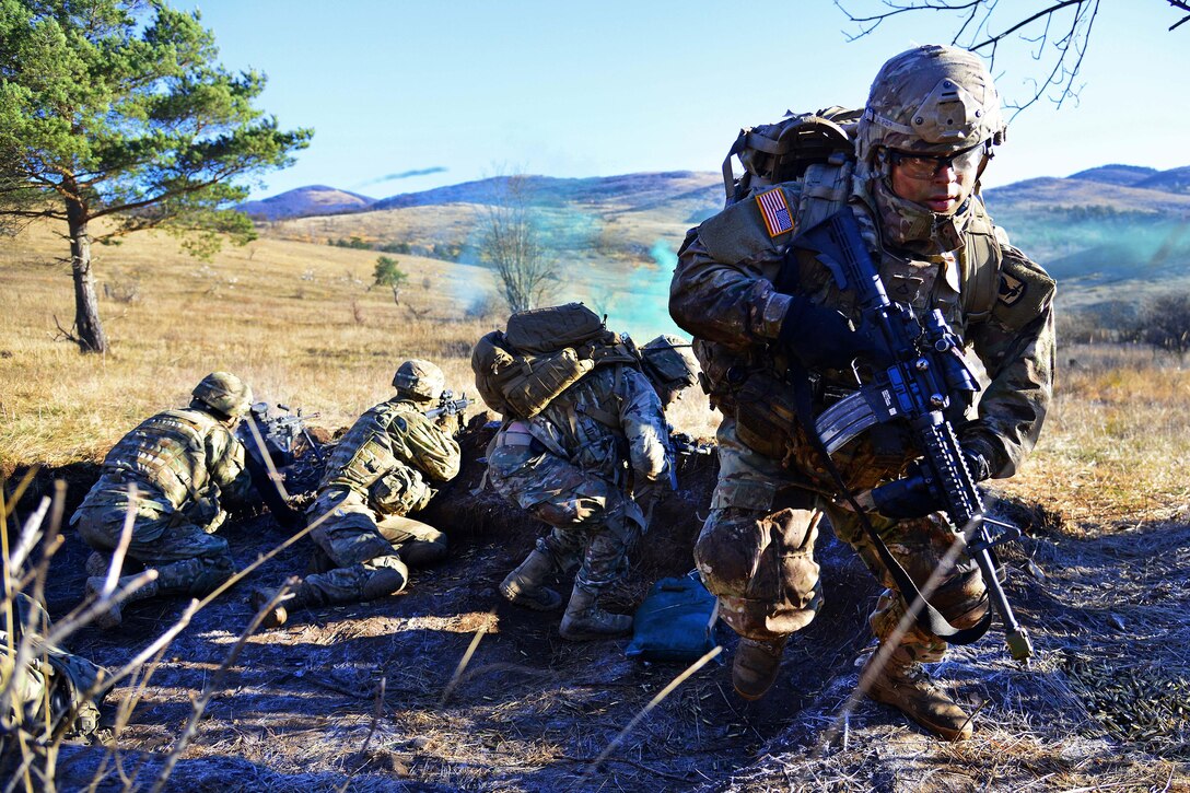 Soldiers engage targets as team members move to a new position during a live-fire exercise as part of Exercise Mountain Shock at Pocek Range in Slovenia, Dec. 9, 2016. Army photo by Davide Dalla Massara 