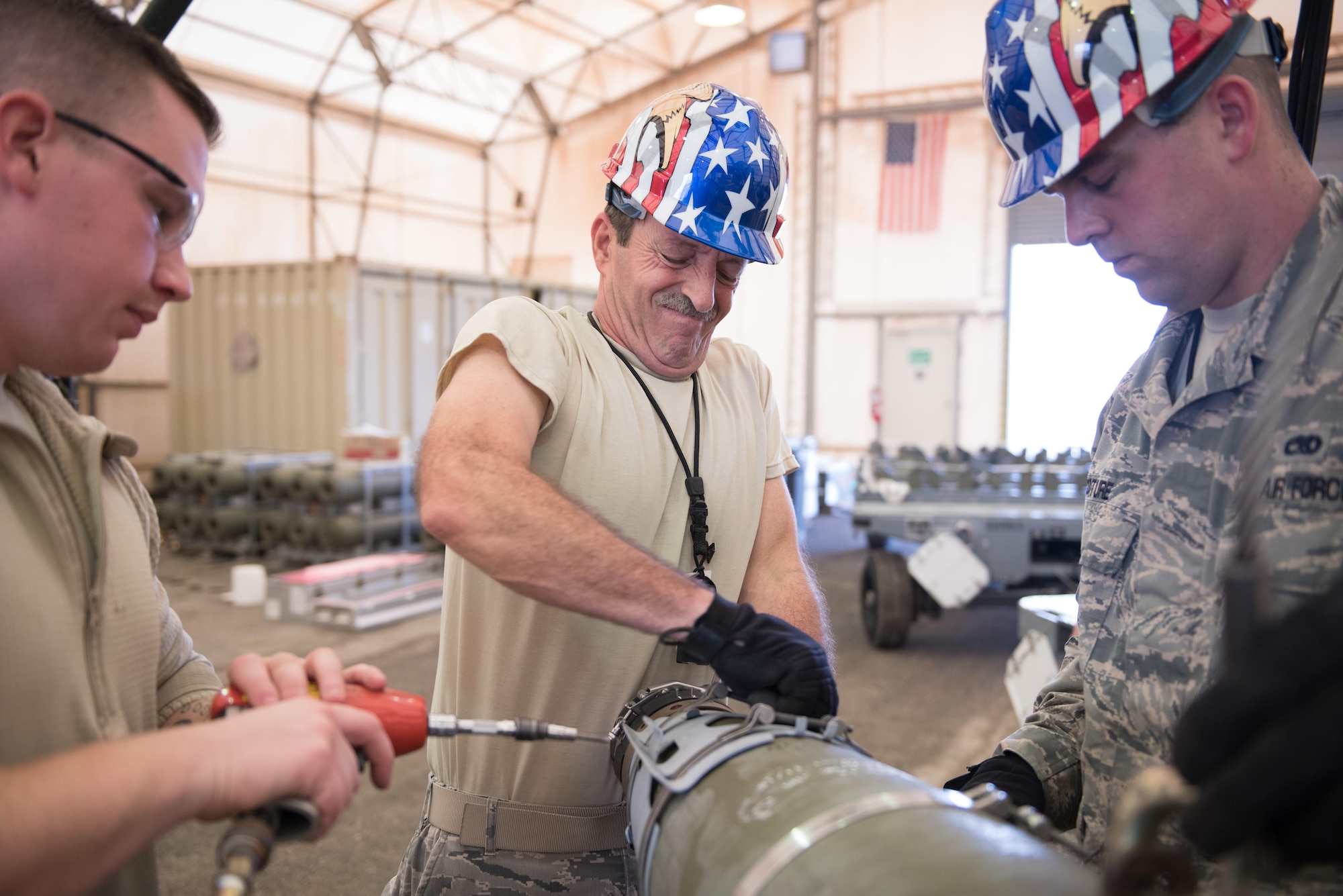 Vermont Air National Guard Master Sgt. Peter Callahan, 134th Expeditionary Fighter Squadron weapons maintenance technician, ensures the forward laser strap of a of a 500-pound joint direct attack munition is straight during the assembly process at the 407th Air Expeditionary Group, Southwest Asia, Dec. 2, 2016. Callahan is part of an advanced team preparing for the arrival of Vermont ANG F-16 Fighting Falcons, which will be used against ISIL in Operation Inherent Resolve. (U.S. Air Force photo/Master Sgt. Benjamin Wilson)(Released)