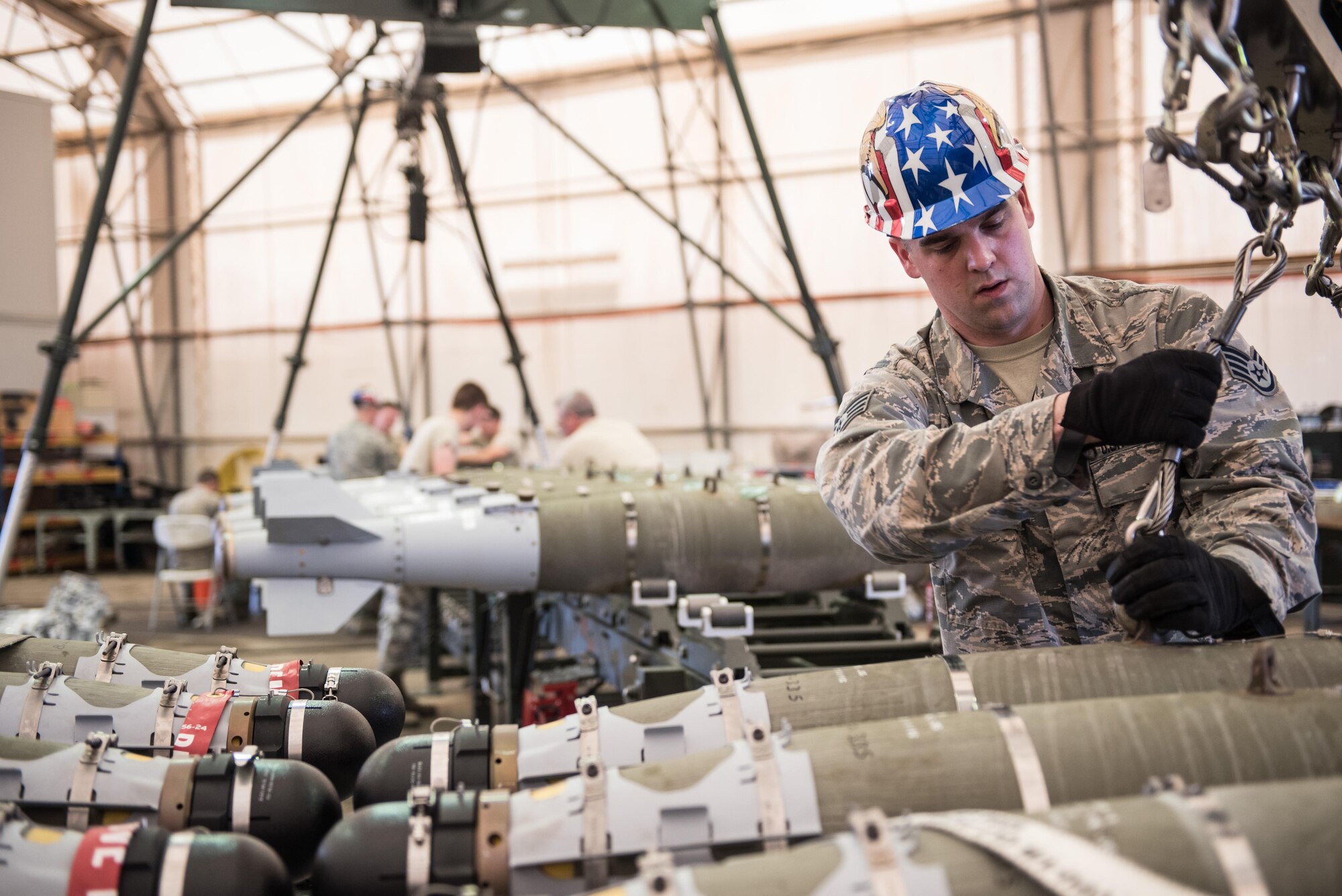 Vermont Air National Guard Staff Sgt. Mark Couture, 134th Expeditionary Fighter Squadron weapons maintenance technician, transports a 500-pound joint direct attack munition from the assembly line at the 407th Air Expeditionary Group, Southwest Asia, Dec. 2, 2016. The F-16 Fighting Falcons from the 134th EFS will work with a coalition of about 60 regional and international nations to counter ISIL’s campaign in Iraq and Syria.  (U.S. Air Force photo/Master Sgt. Benjamin Wilson)(Released)