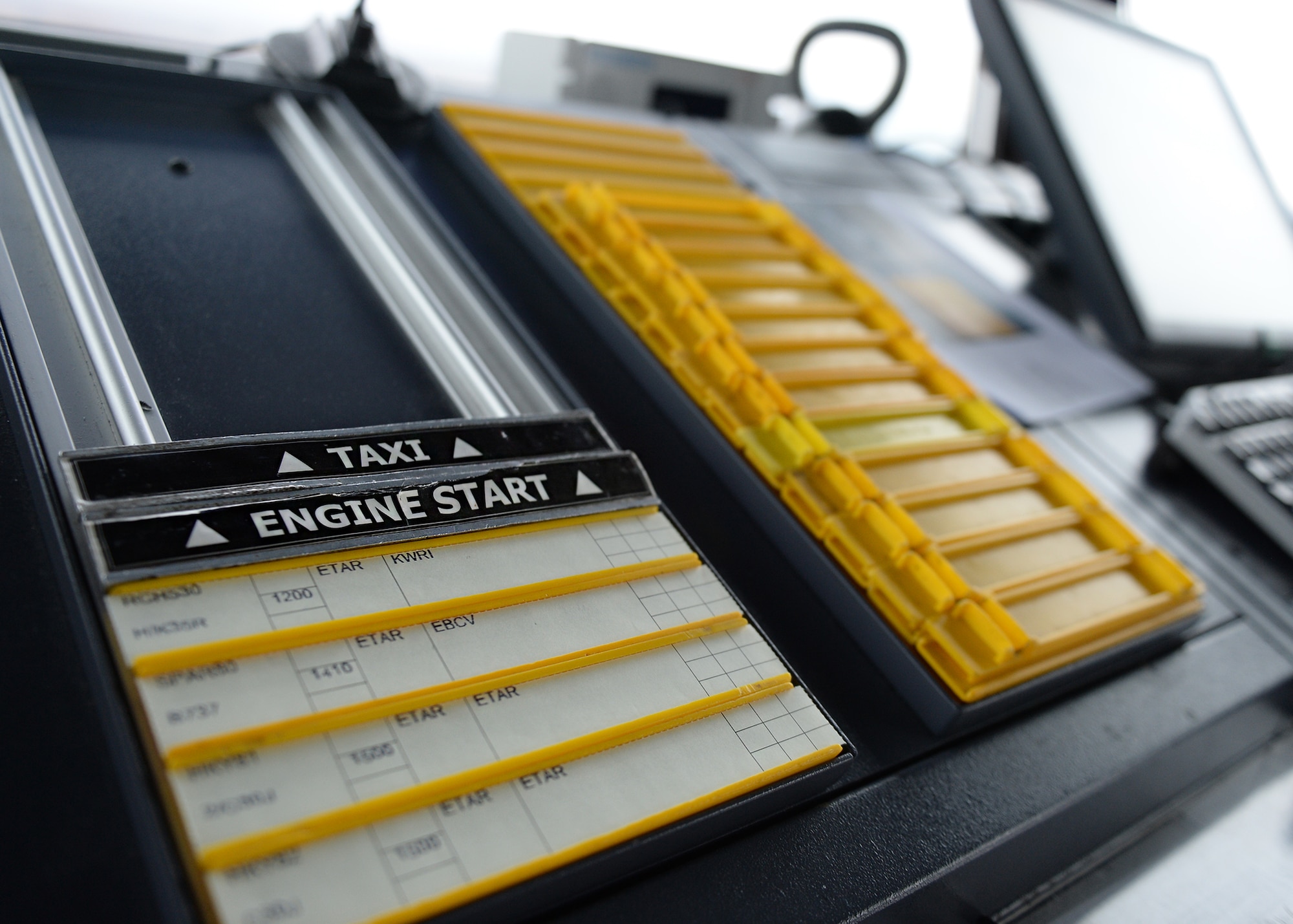 Flight progress strips are displayed on a workstation at Ramstein Air Base, Germany, Dec 13, 2016. Flight progress strips are used to track any pertinent information for flights coming in or going out of an airfield. (U.S. Air Force photo by Senior Airman Jimmie D. Pike)