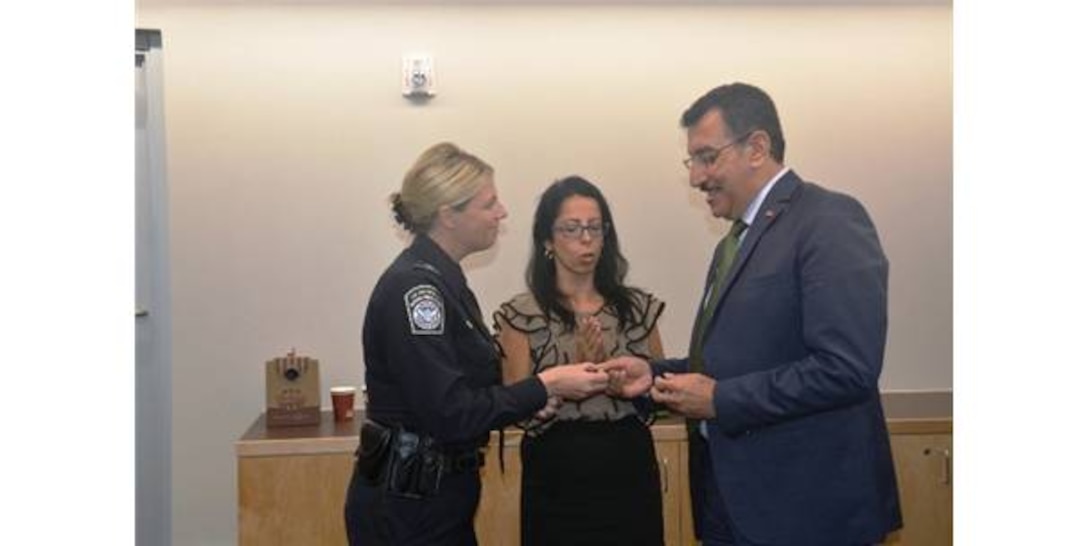 Ms. Pinar Eser, center, Senior Turkish Liaison Officer, Air Force Office of Special Investigations Detachment 521, Ankara, Turkey, translates a conversation between Rose Hilmey, U.S. Buffalo Regional Border Protection Unit chief and Bulent Tufenkci, Turkish Customs and Trade minister. 
(Courtesy photo/AFOSI Det. 521) 