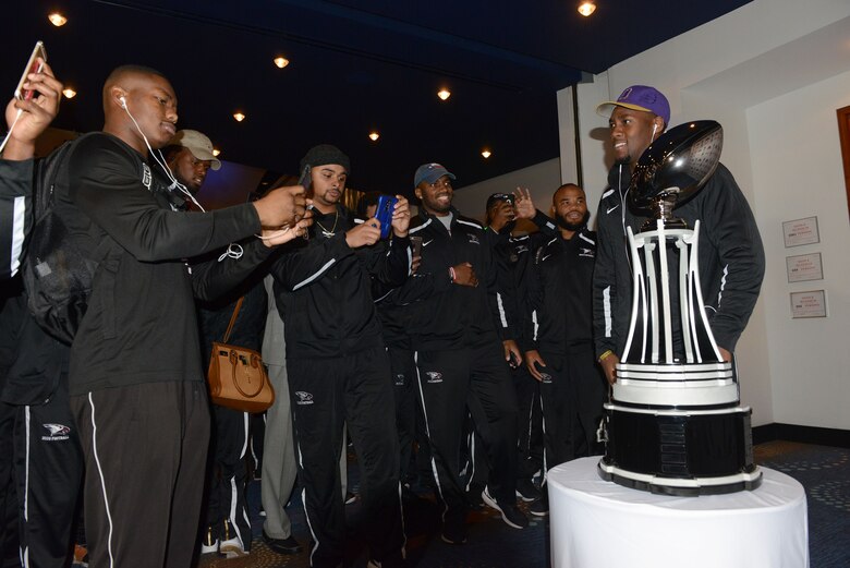 Members of the North Carolina Central football tam get theri first glimpse at the ultimate prize, the Air Force Reserve Celebration Bowl trophy, whichs  represents the Historically Black Colleges and Universities National Championship.The game to determine the champ will be played Saturday at noon at the Georgia Dome in Atlanta and can be seen on ABC. (Air Force photo/Master Sgt Chance Babin)