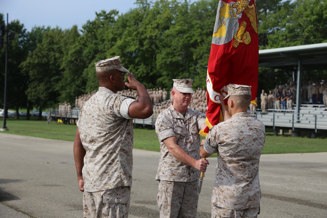 Colonel Daniel E. Longwell, Marine Corps Detachment, passes the Colors to Colonel George W. Markert at Fort Leonard Wood, MO, August 12, 2016. As the new Commanding Officer of Marine Corps Detachment Fort Leonard Wood, Col. Markert assume all duties and responsibilities. (U.S. Marine Corps photo by Sgt. Teng Yang)